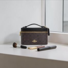 Trousse à maquillage en toile Coach Marron